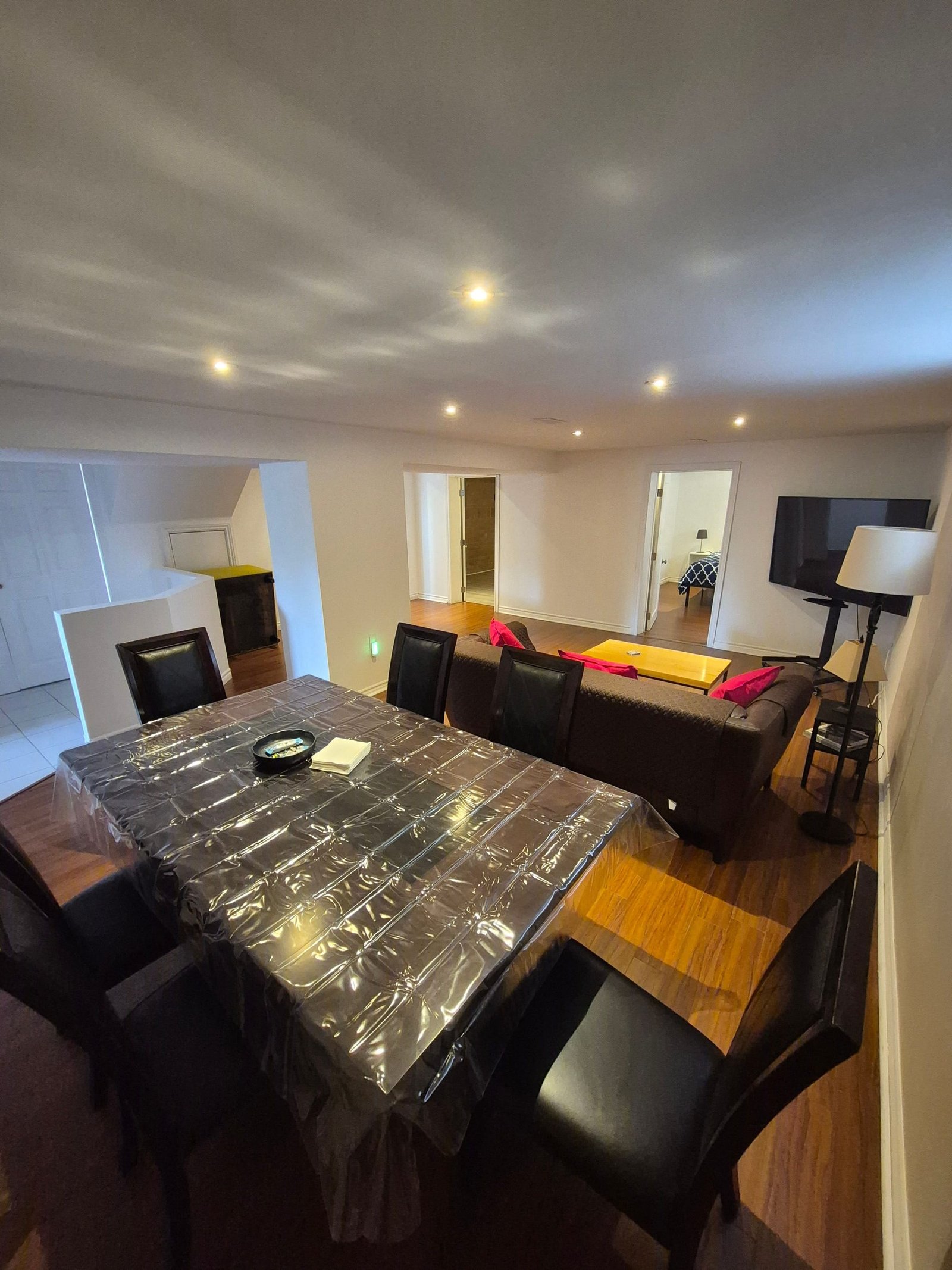 Dining table with the living area and television beyond